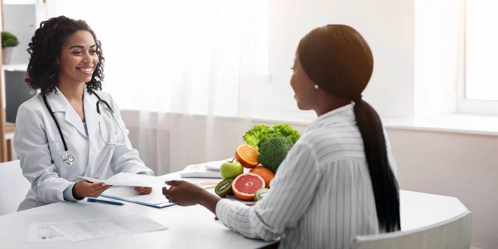 female dietician giving patient informative brochu 2024 10 15 23 13 10 utc 1